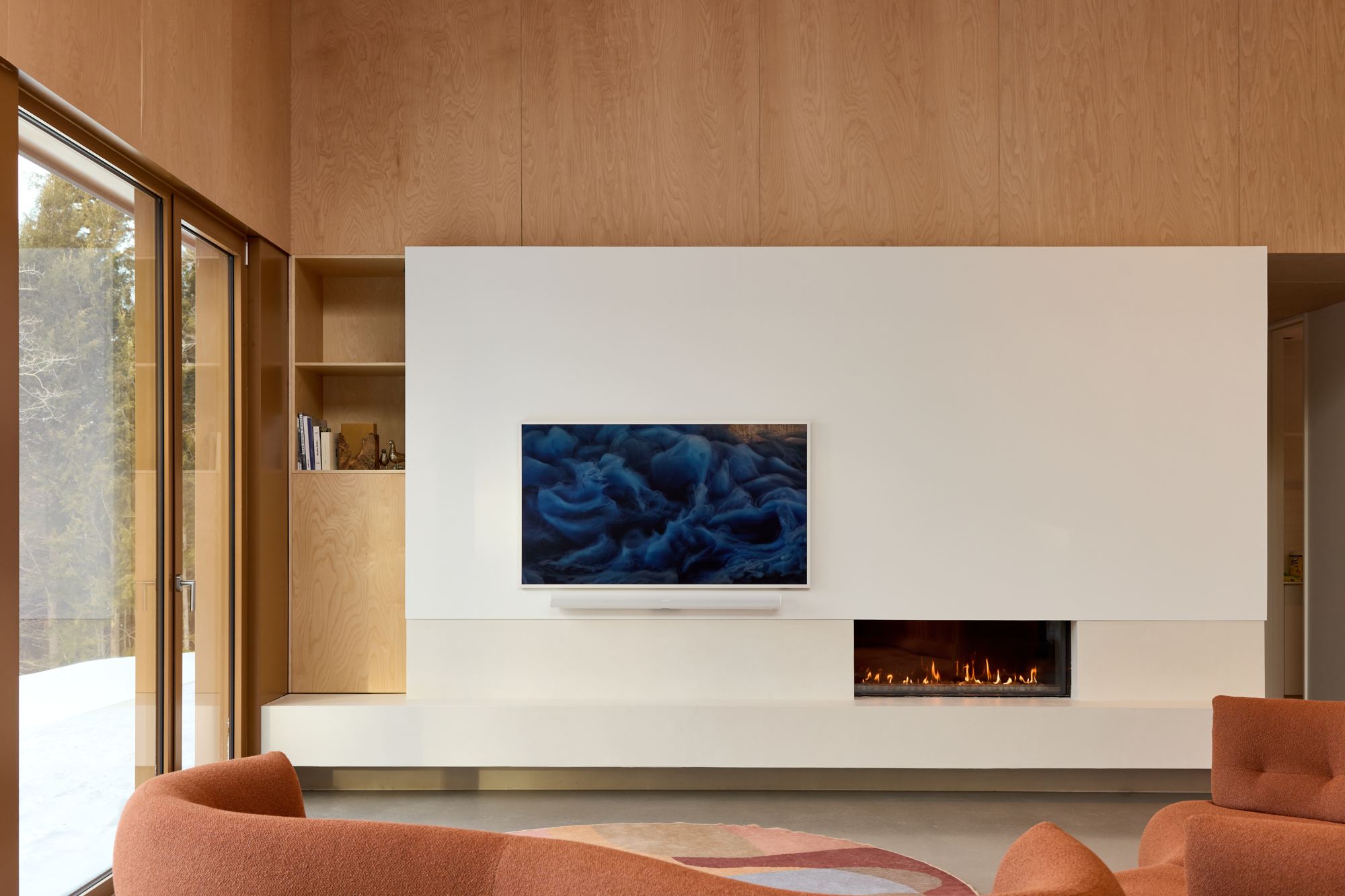 Bright living room in a Magog residence, with lighting and shades controlled by Adom