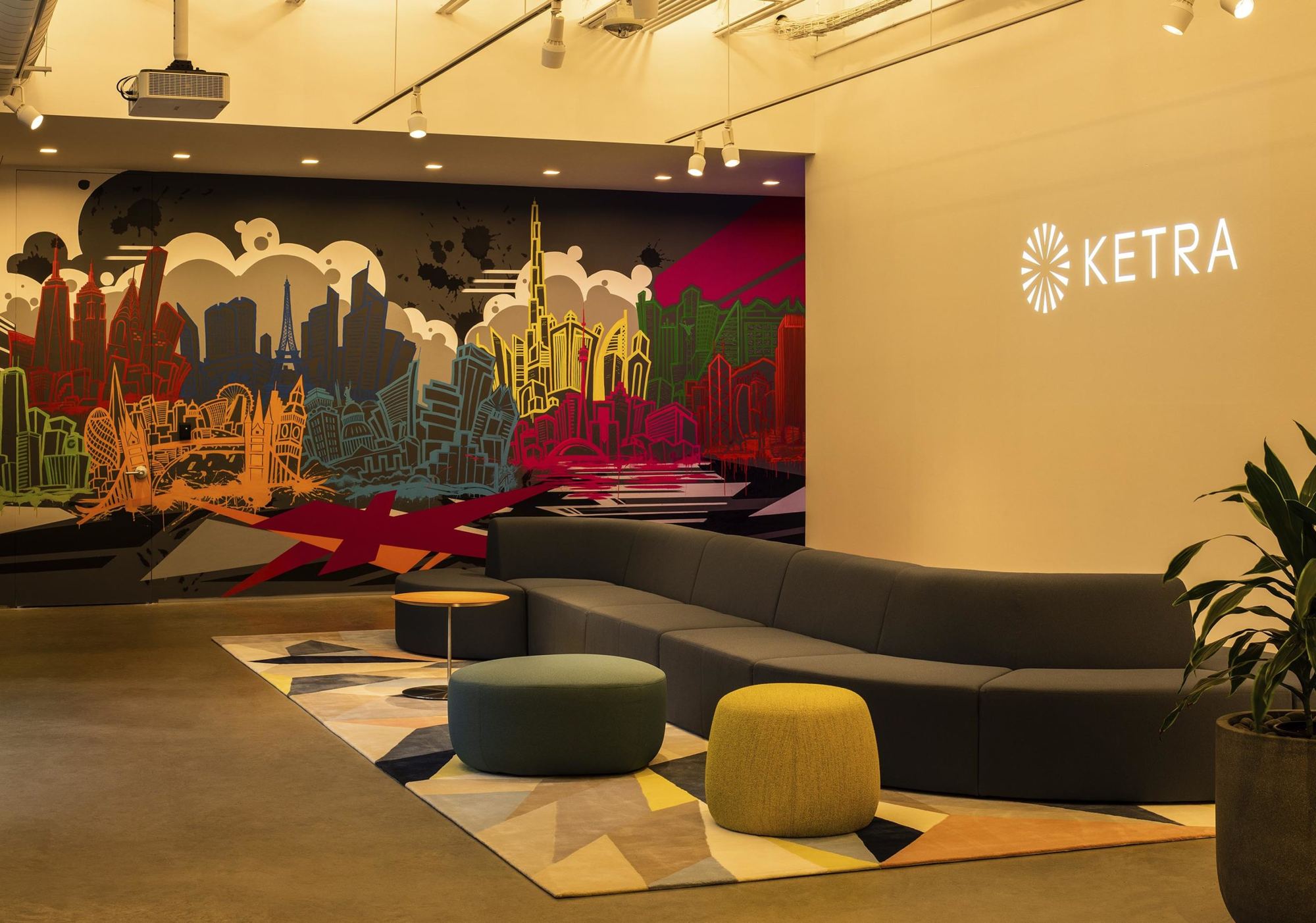 Salle de présentation éclairée par Ketra, murale colorée