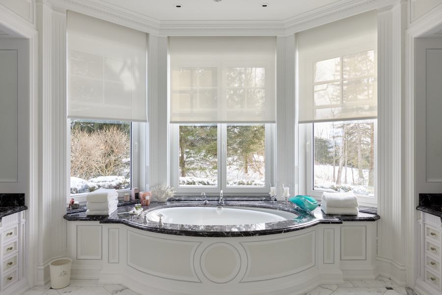 Motorized shades by Lutron in Bathroom